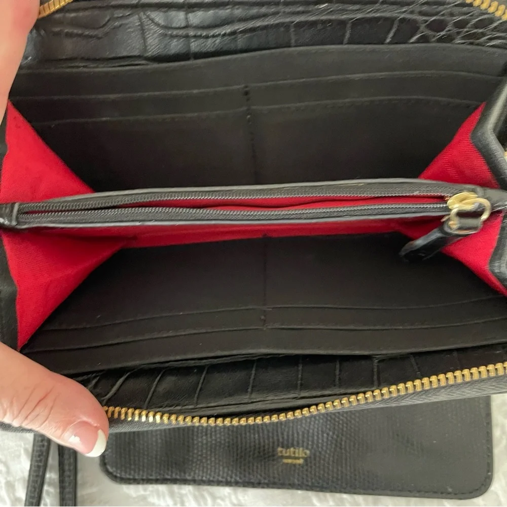 NWOT Tutilo Black wallet with wristlet. Gold hardware. Very nice